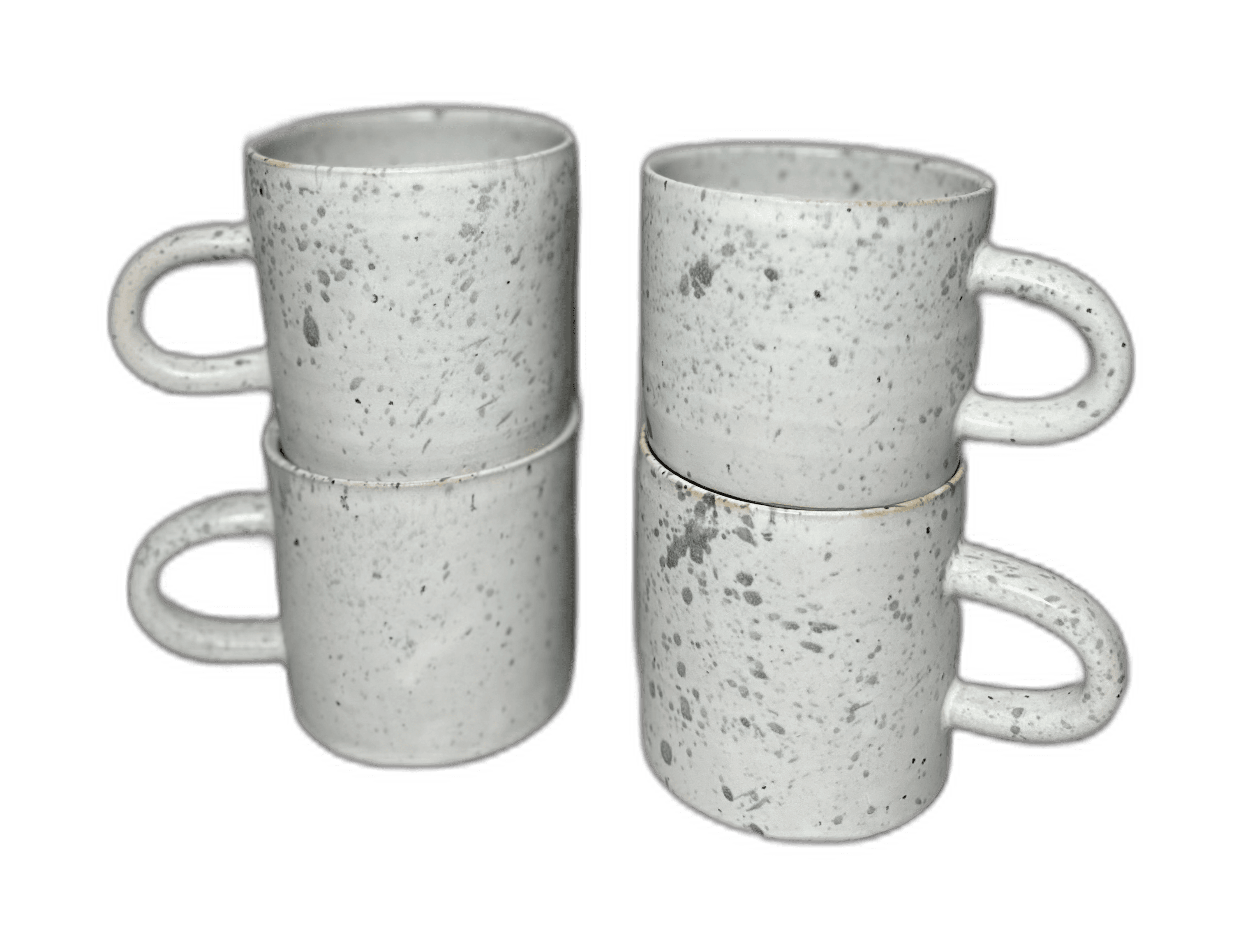 A second pair of speckled mugs photographed in the studio